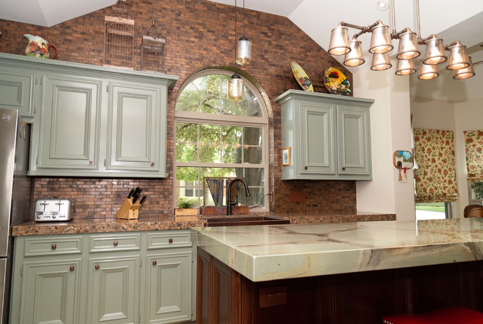 Inspiration for a large traditional u-shaped kitchen pantry in Houston with with island, a farmhouse sink, beaded inset cabinets, green cabinets, quartzite benchtops, brown splashback, metal splashback, stainless steel appliances, porcelain floors, beige floor and green benchtop.