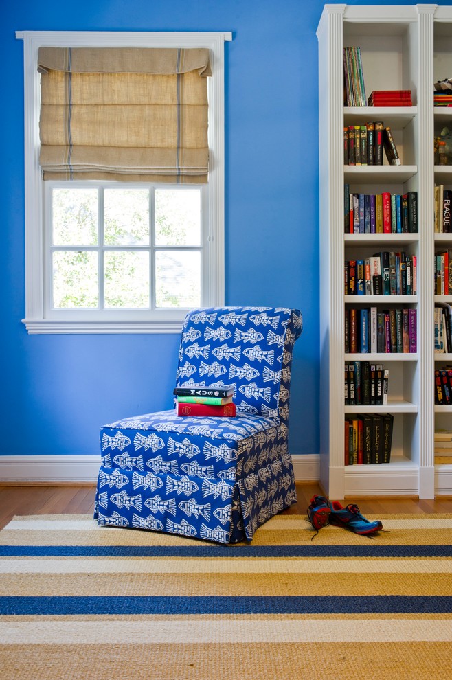 Inspiration for a transitional kids' bedroom for boys in Charleston with blue walls and light hardwood floors.