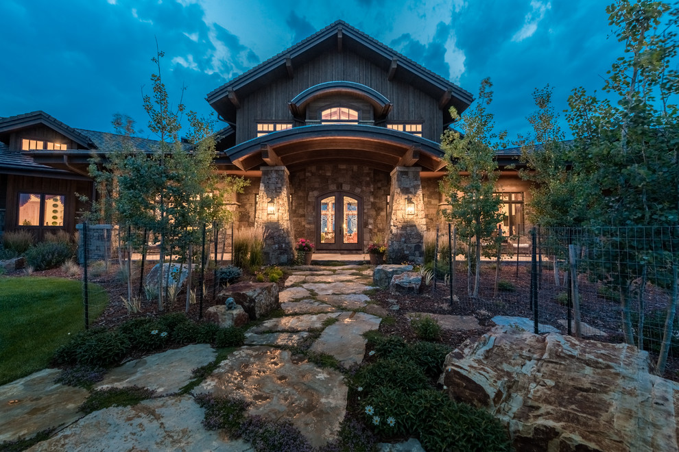 Photo of a country home design in Denver.