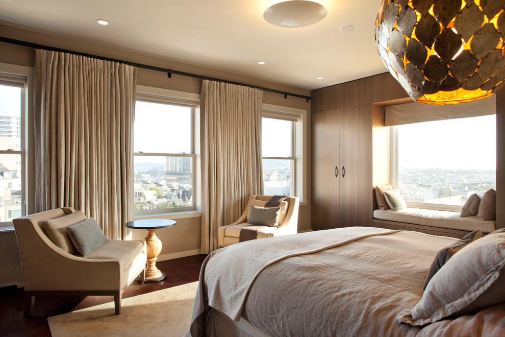 Design ideas for a contemporary bedroom in San Francisco with beige walls and dark hardwood floors.