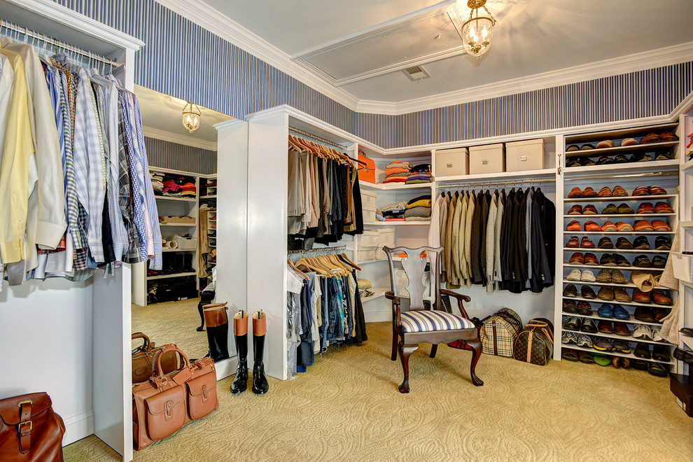Traditional men's walk-in wardrobe in DC Metro with open cabinets, carpet and white cabinets.