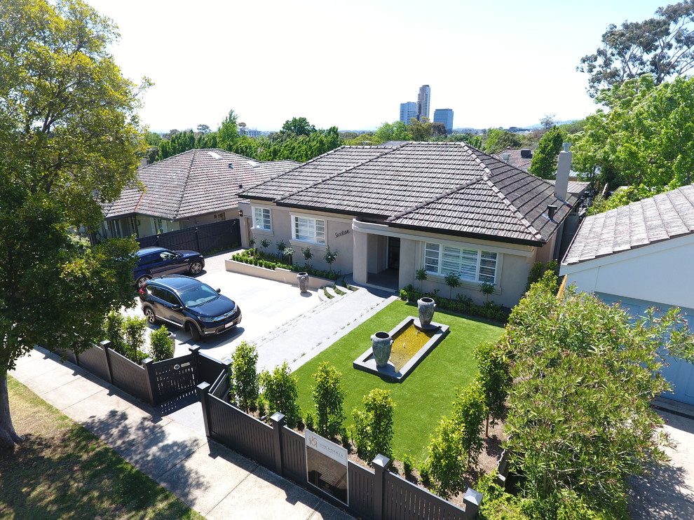 Inspiration for a large contemporary two-storey brick white house exterior in Melbourne with a gable roof and a tile roof.