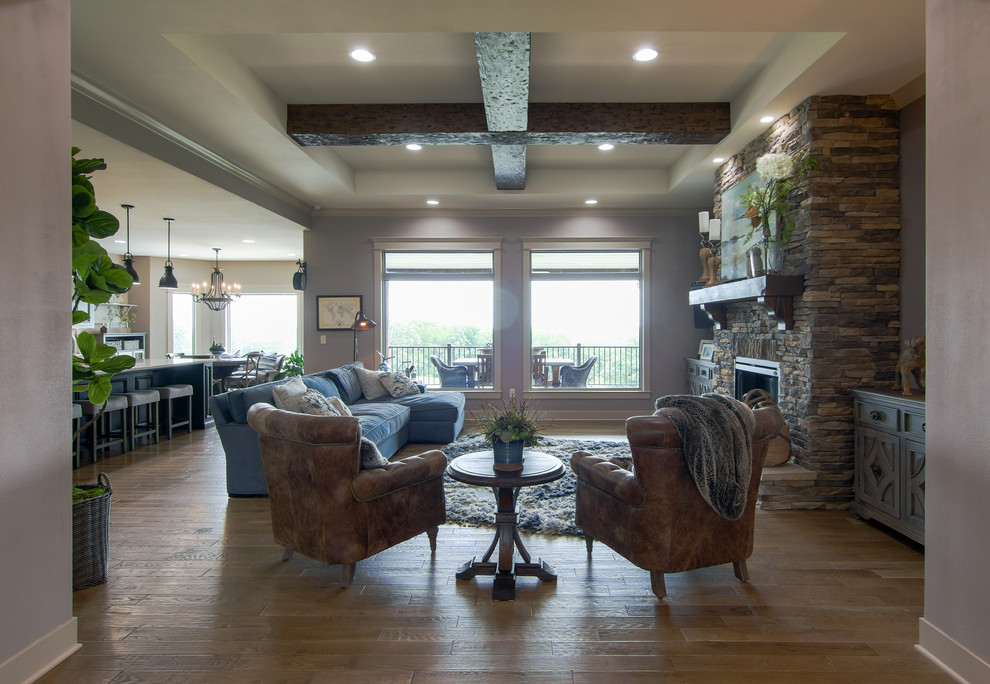 Inspiration for a large rustic medium tone wood floor and brown floor foyer remodel with gray walls and a dark wood front door