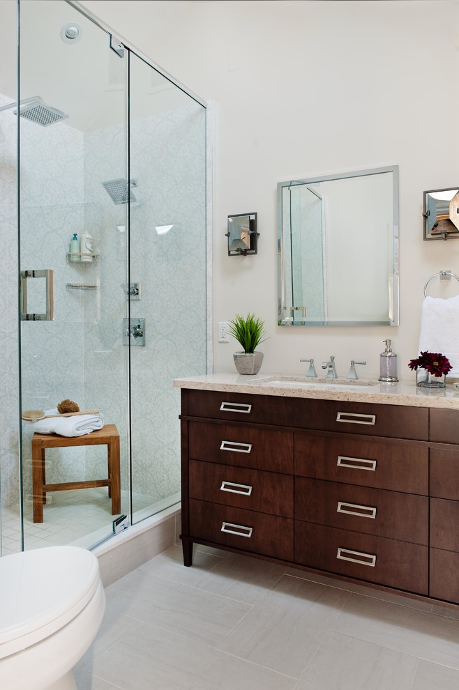 Mid-sized traditional master bathroom in Toronto with an undermount sink, dark wood cabinets, beige walls, engineered quartz benchtops, a one-piece toilet, gray tile, mosaic tile, porcelain floors and flat-panel cabinets.