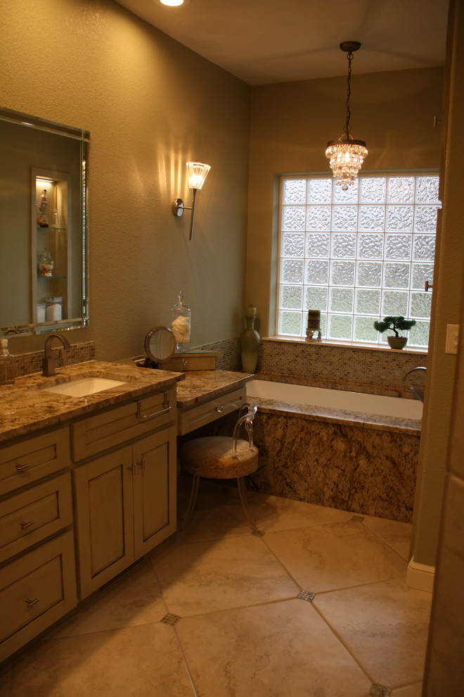 Corner shower - large transitional master multicolored tile and porcelain tile porcelain tile corner shower idea with raised-panel cabinets, green cabinets, an undermount tub, green walls, an undermount sink and granite countertops