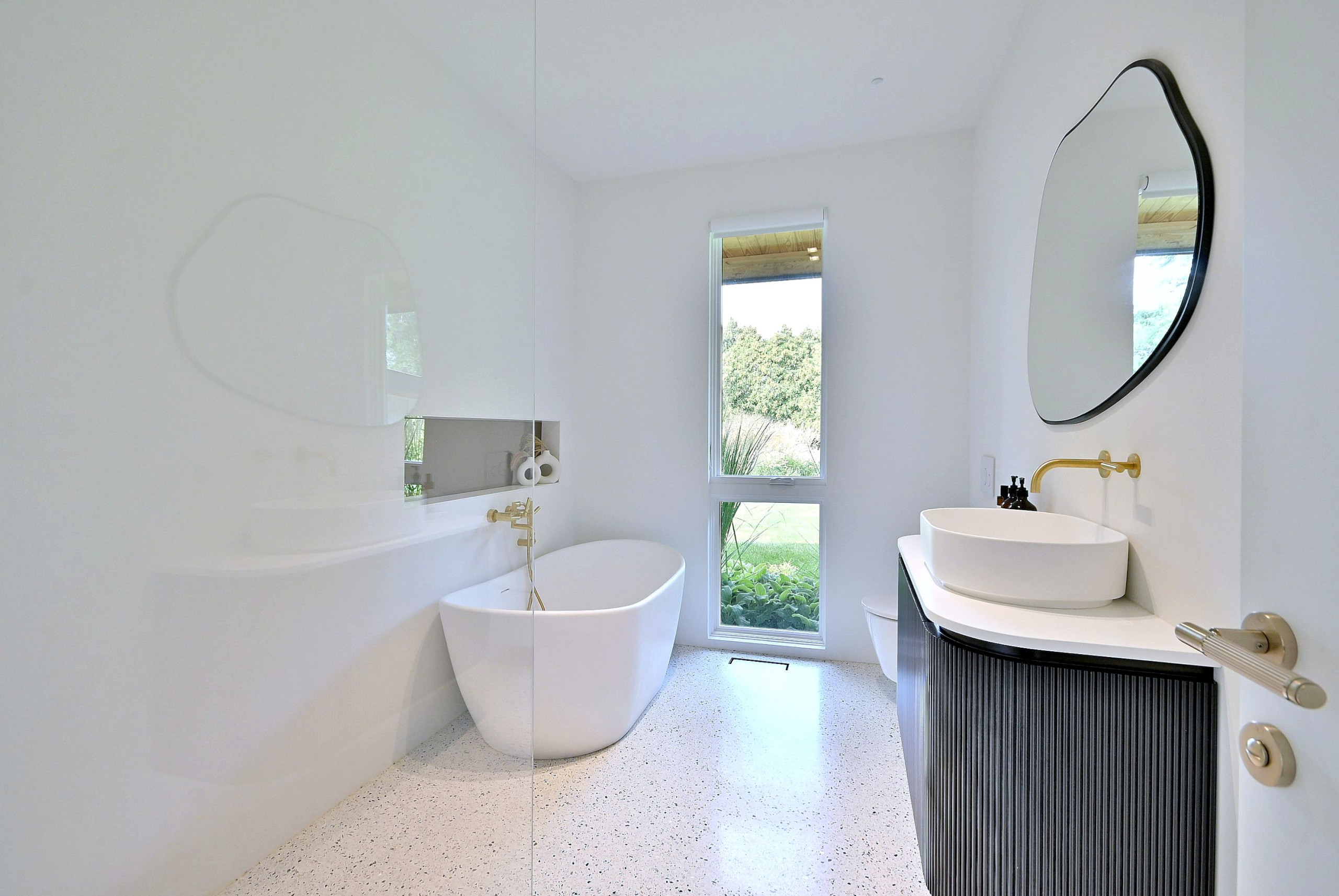Mid-Century Modern Bathroom with Freestanding Tub