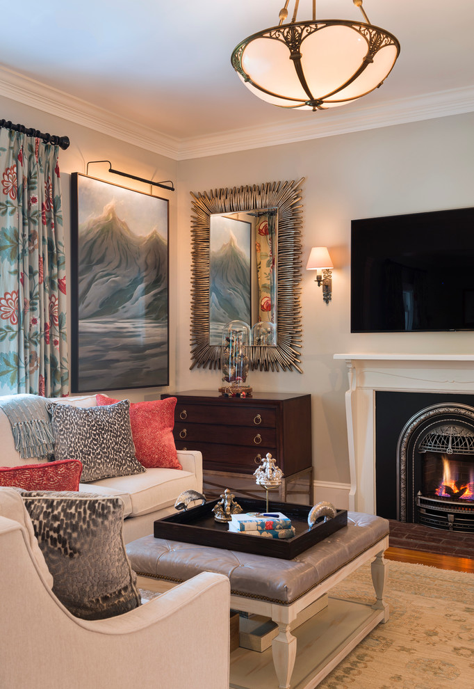 This is an example of a traditional formal enclosed living room in Providence with grey walls, a standard fireplace and a wall-mounted tv.