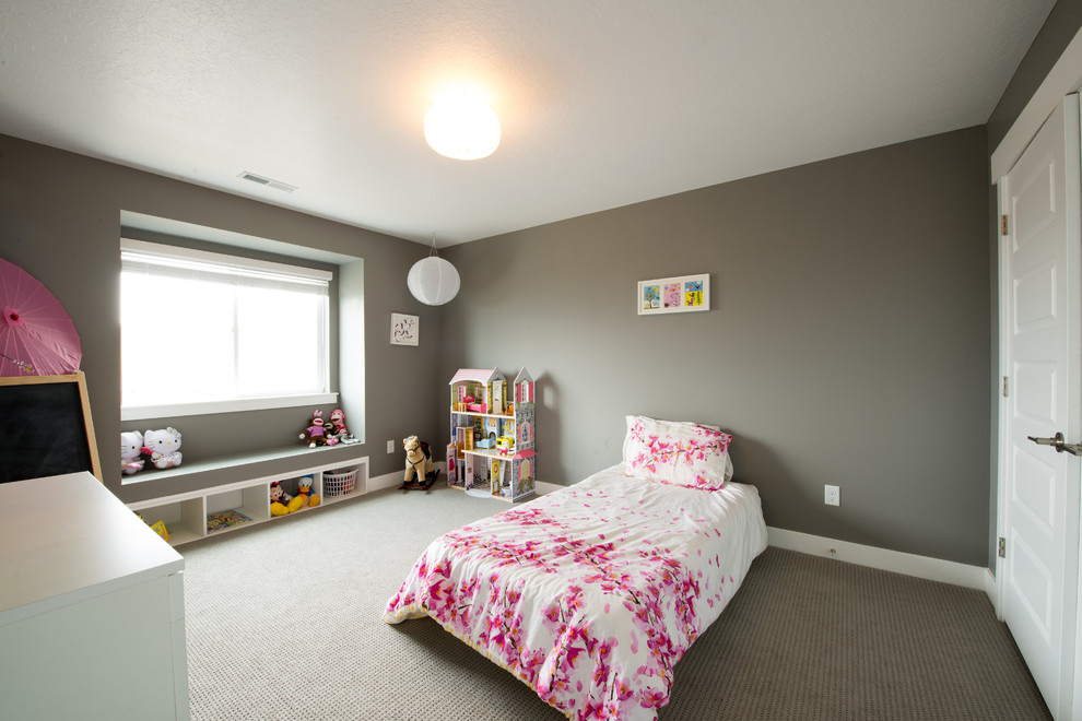 Photo of a mid-sized contemporary kids' bedroom for kids 4-10 years old and girls in Salt Lake City with grey walls and carpet.