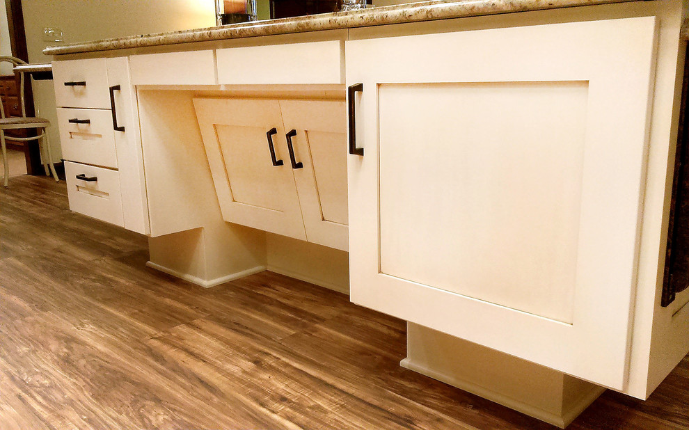 Large transitional l-shaped medium tone wood floor open concept kitchen photo with an undermount sink, shaker cabinets, medium tone wood cabinets, granite countertops, beige backsplash, ceramic backsplash, white appliances and an island