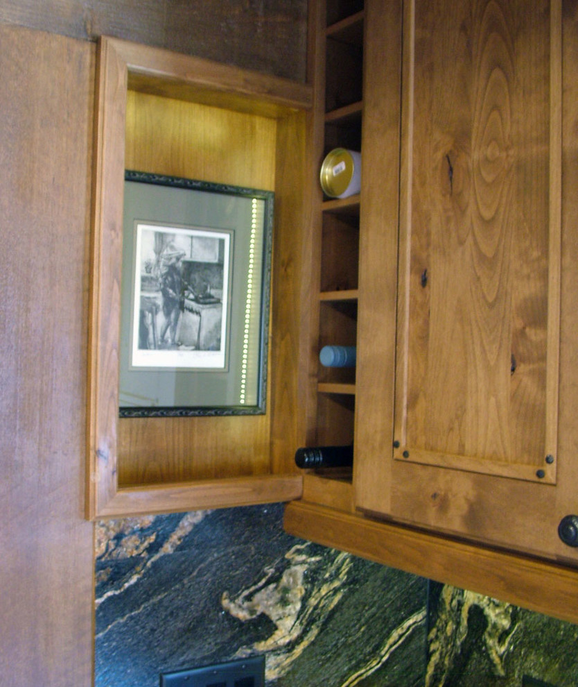 Kitchen pantry - mid-sized rustic u-shaped light wood floor kitchen pantry idea in Denver with a farmhouse sink, flat-panel cabinets, dark wood cabinets, granite countertops, black backsplash, stone slab backsplash, stainless steel appliances and no island