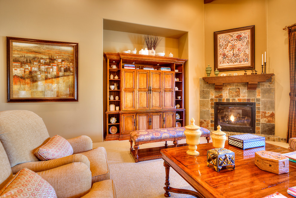 This is an example of an expansive traditional open concept family room in Phoenix with carpet, a corner fireplace, a stone fireplace surround and a built-in media wall.