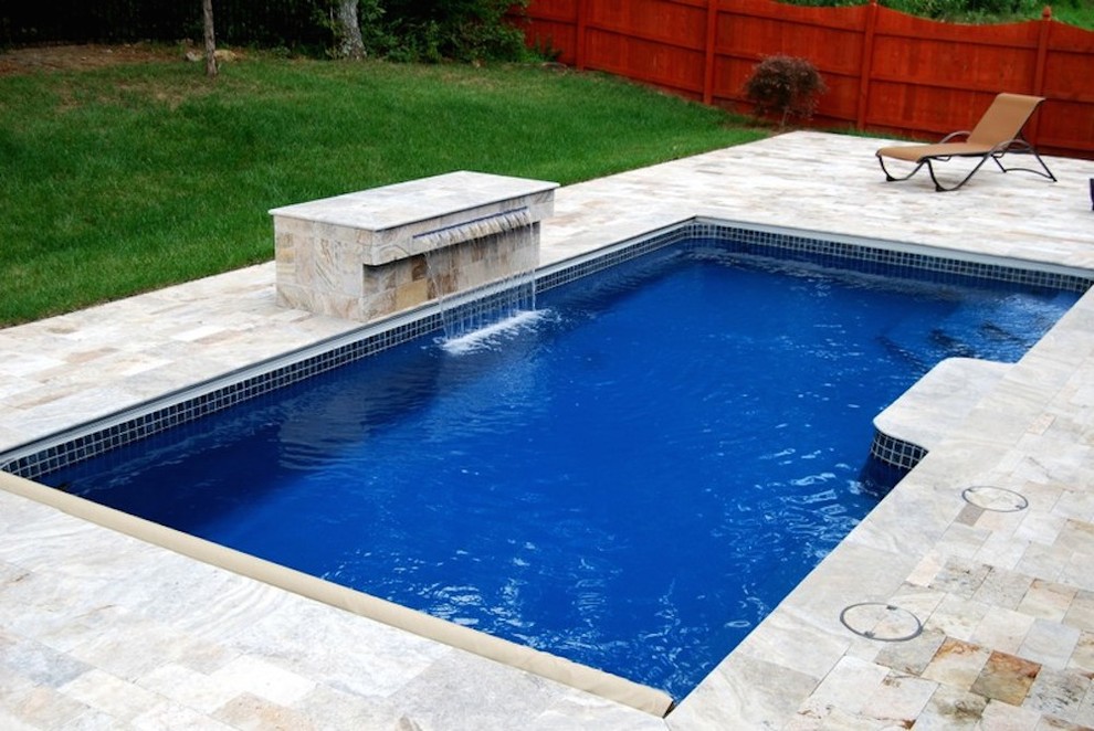 Mid-sized transitional backyard concrete paver and rectangular pool fountain photo in Nashville