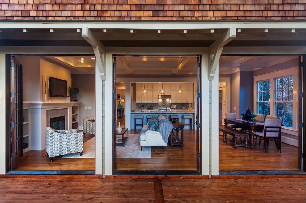 Deck - mid-sized transitional backyard deck idea in Raleigh with a roof extension