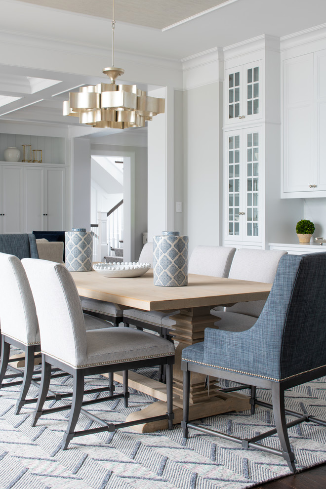 Example of a mid-sized transitional dark wood floor and brown floor dining room design in Minneapolis with gray walls and no fireplace