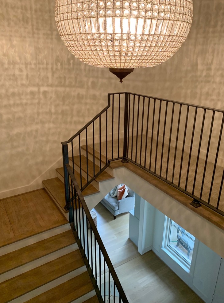 Design ideas for a large modern staircase in Houston with wallpaper.
