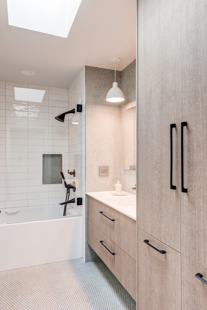 Small contemporary master bathroom in San Francisco with flat-panel cabinets, beige cabinets, a shower/bathtub combo, multi-coloured tile, pebble tile floors, a trough sink, engineered quartz benchtops, an open shower and white benchtops.