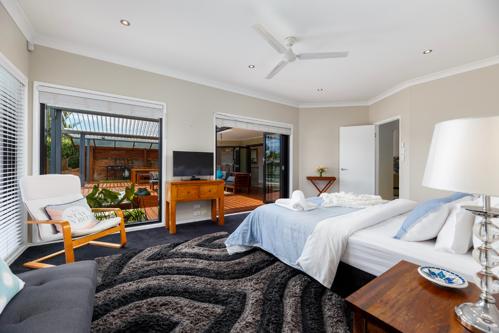 Design ideas for a beach style master bedroom in Gold Coast - Tweed.