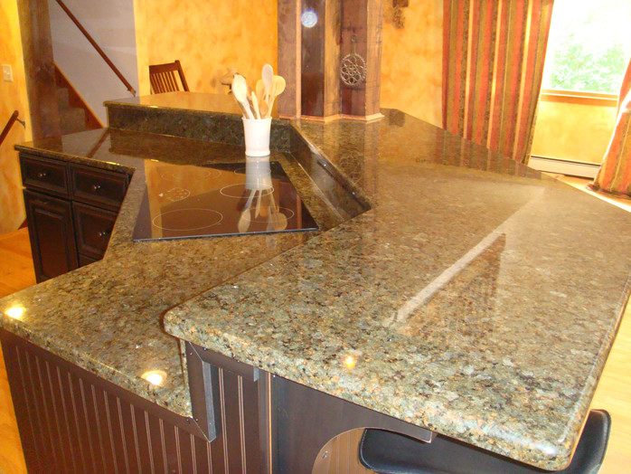 Example of a mid-sized medium tone wood floor eat-in kitchen design in Boston with raised-panel cabinets, medium tone wood cabinets, granite countertops and an island