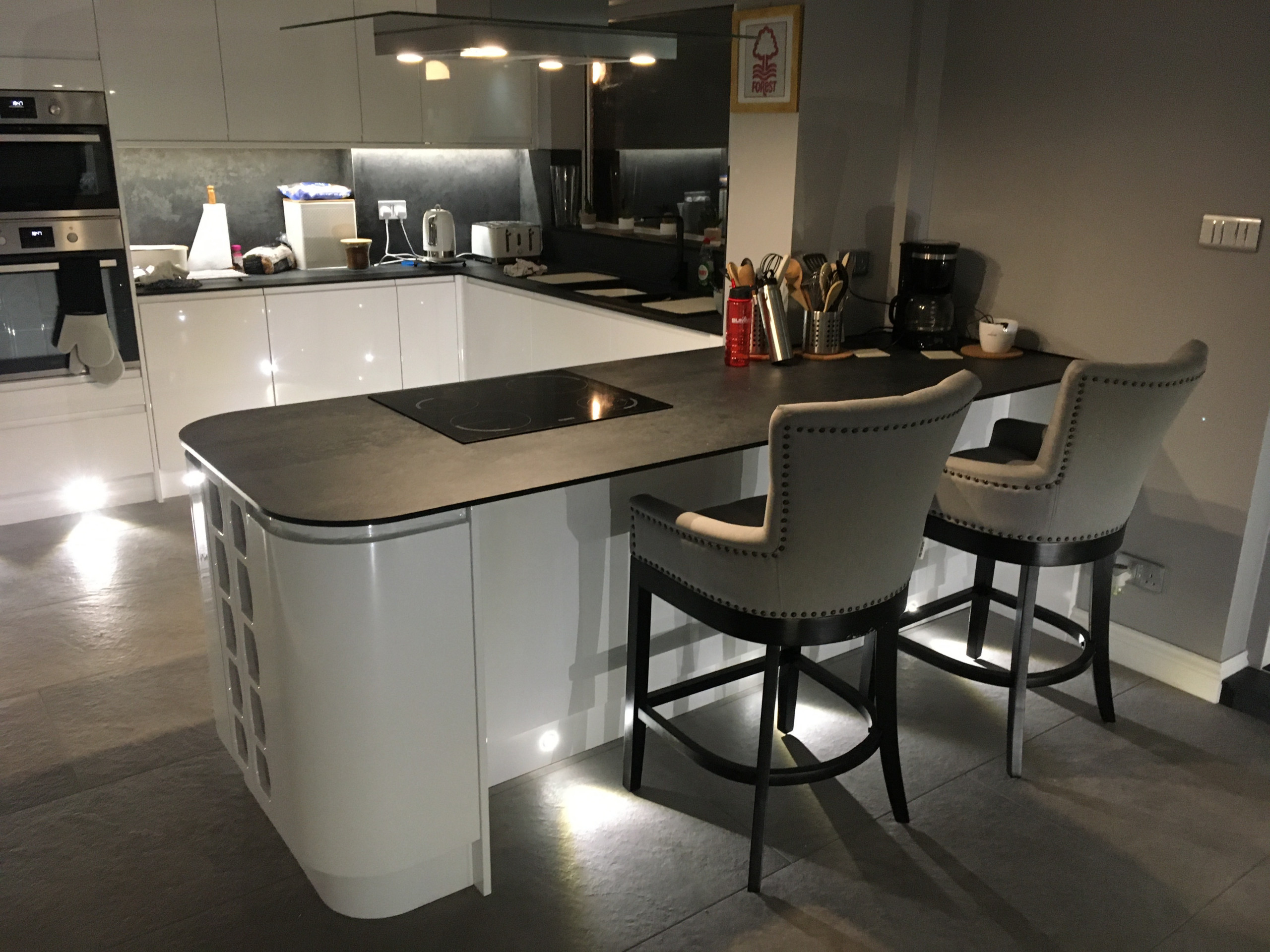 J pull handle Kitchen with compact laminate and porcelain floor tiles