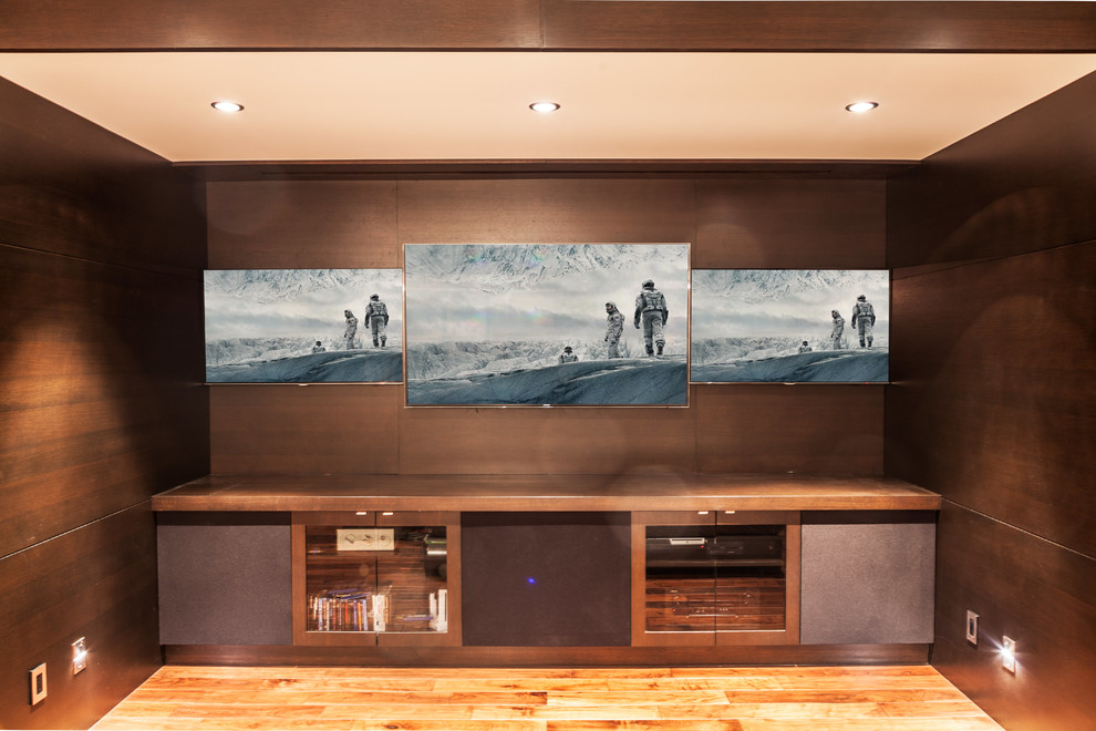 Inspiration for a contemporary home theatre in Vancouver with a built-in media wall.