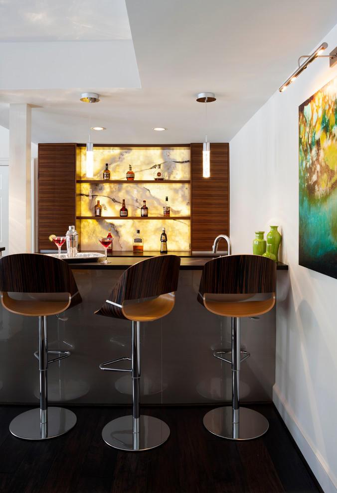 This is an example of a contemporary home bar in DC Metro with dark hardwood floors, open cabinets, medium wood cabinets and multi-coloured splashback.