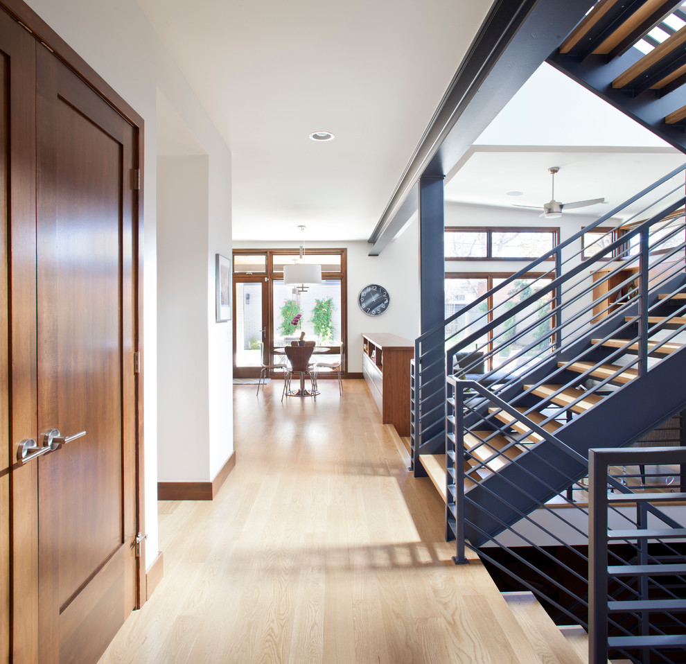Design ideas for a contemporary wood u-shaped staircase in Denver with open risers.
