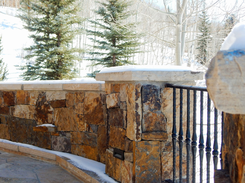 Example of a mountain style home design design in Denver