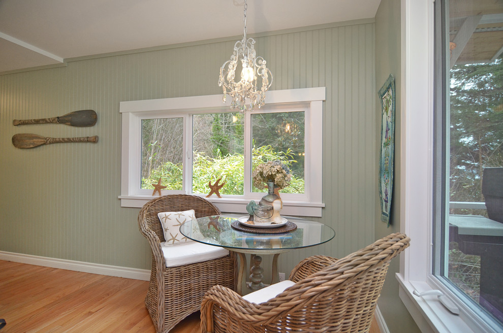 Small beach style kitchen/dining combo in Seattle with light hardwood floors.