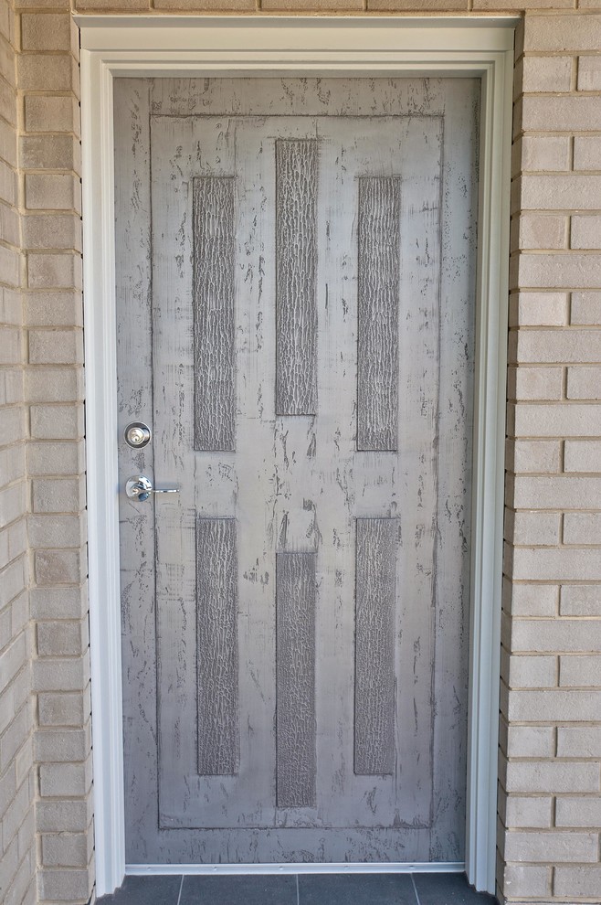 This is an example of a country entryway in Adelaide with a single front door.