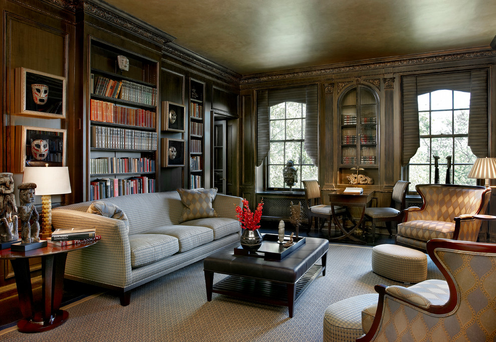 Photo of a large traditional enclosed family room in Chicago with a library, brown walls, no fireplace, no tv, dark hardwood floors, brown floor and wood walls.