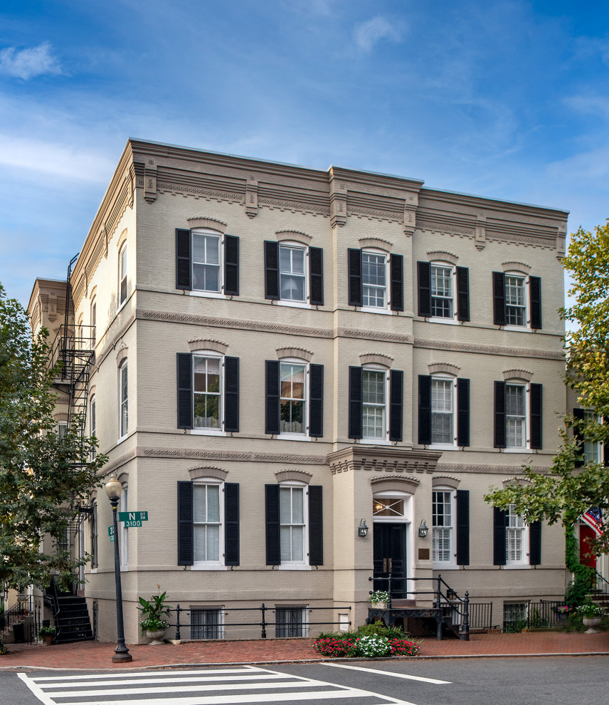 Traditional brick flat in DC Metro with four floors and a flat roof.