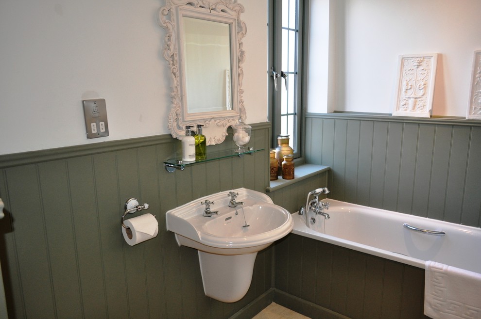 Photo of a traditional bathroom in West Midlands with a wall-mount sink.