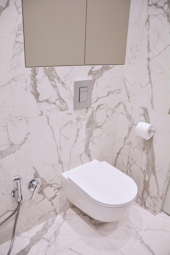 Photo of a mid-sized contemporary powder room in Other.