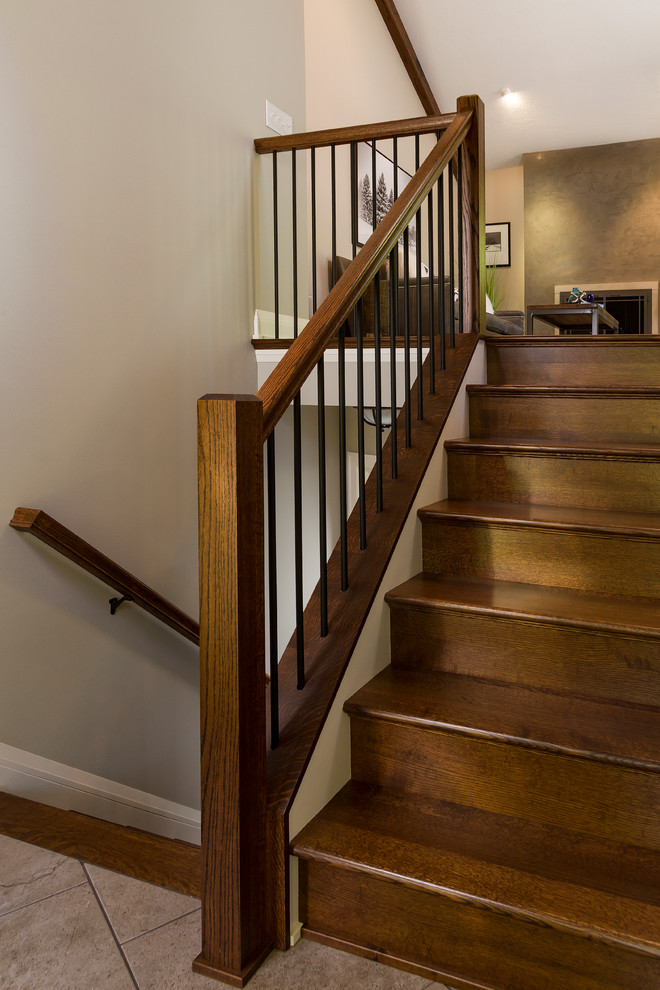 Photo of a transitional wood straight staircase in Minneapolis with wood risers.
