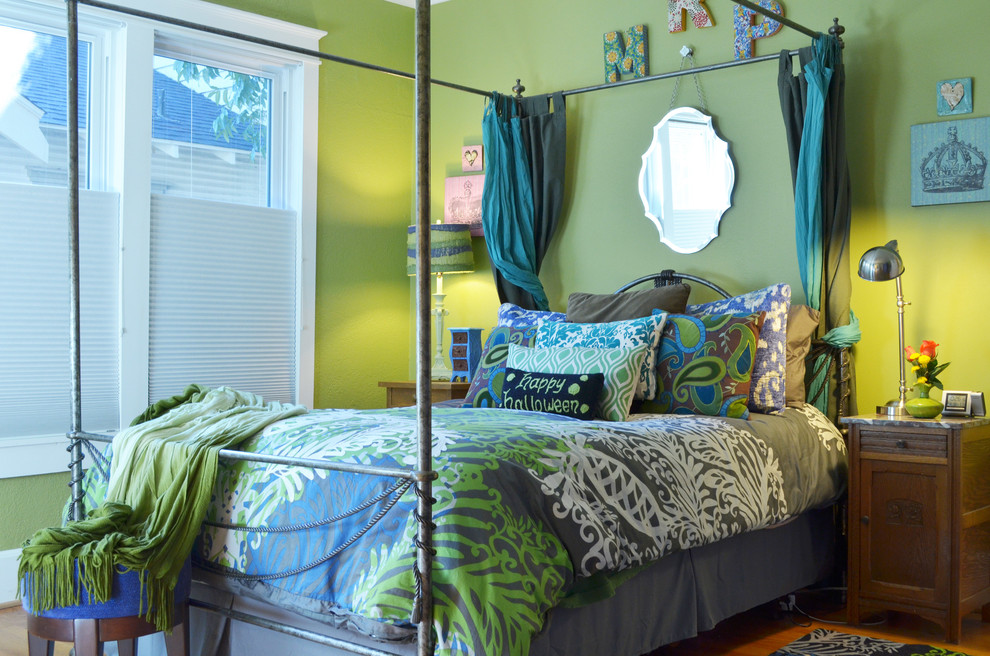 This is an example of a traditional bedroom in Dallas with green walls.