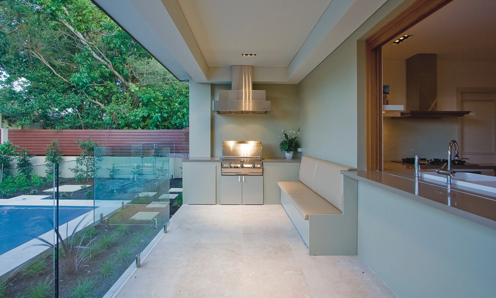This is an example of a contemporary patio in Sydney with a roof extension.