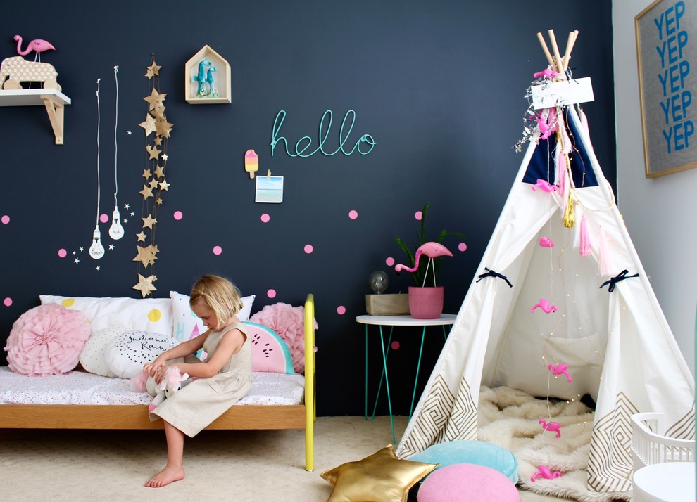 This is an example of a mid-sized eclectic kids' room for girls in Perth with grey walls and carpet.