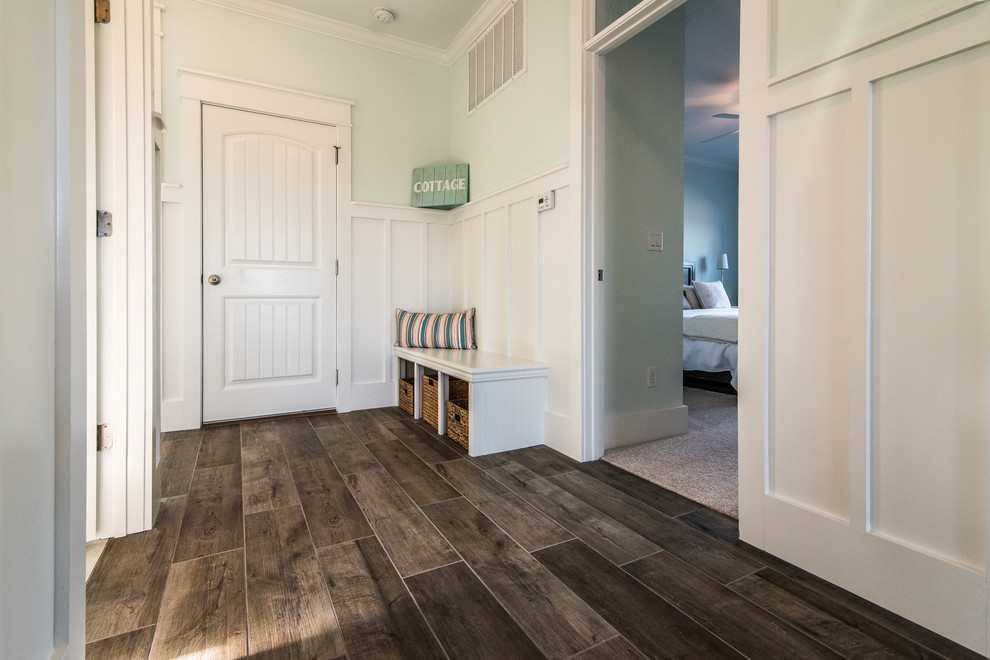 Design ideas for a large beach style hallway in Jacksonville with blue walls and medium hardwood floors.