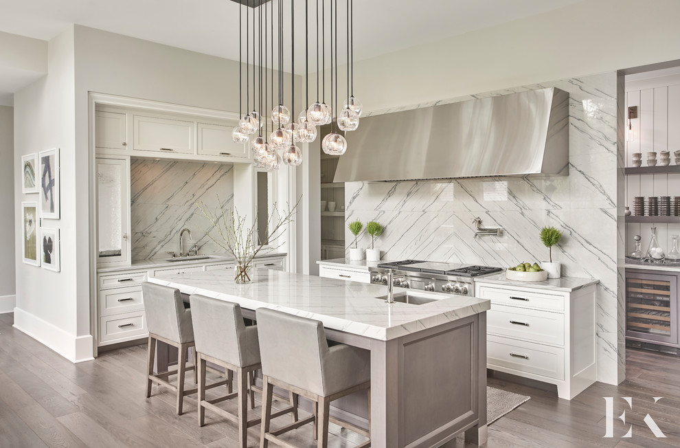 Design ideas for a mid-sized modern eat-in kitchen in Chicago with an undermount sink, recessed-panel cabinets, white cabinets, stainless steel appliances, medium hardwood floors and with island.