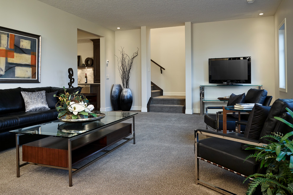 Basement - transitional walk-out carpeted basement idea in Calgary with beige walls