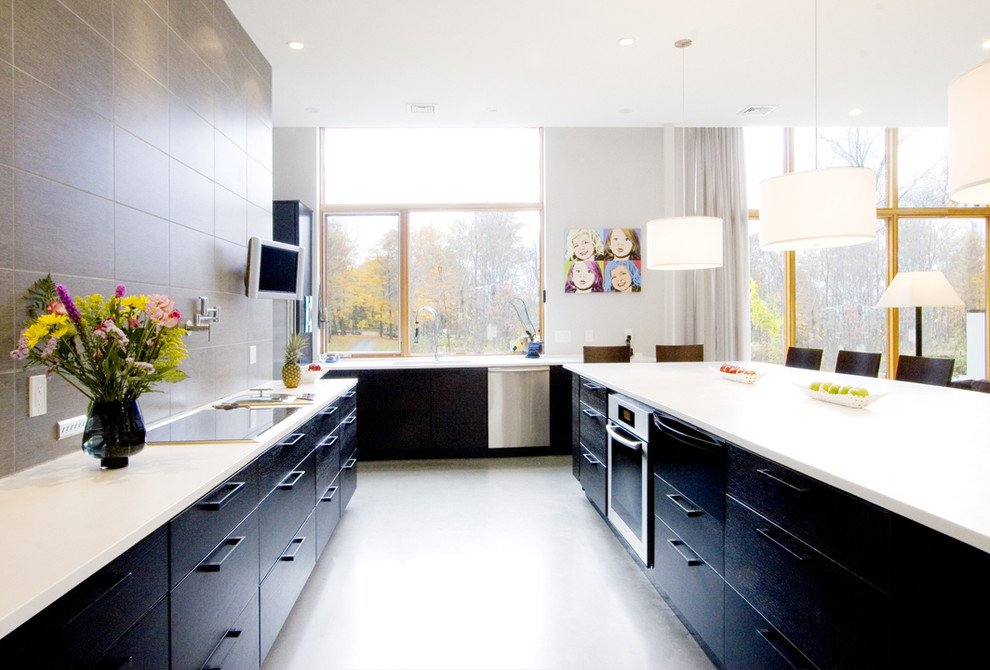 Design ideas for a contemporary kitchen in Boston with stainless steel appliances and flat-panel cabinets.