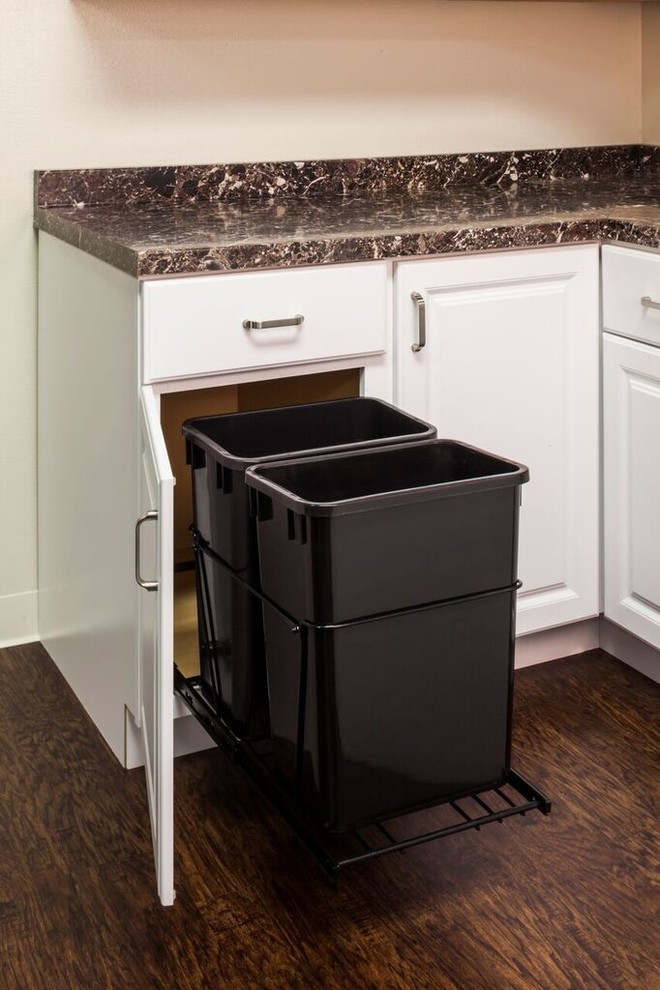 Transitional dark wood floor kitchen photo in New Orleans with a double-bowl sink, shaker cabinets, white cabinets, granite countertops, beige backsplash and black appliances