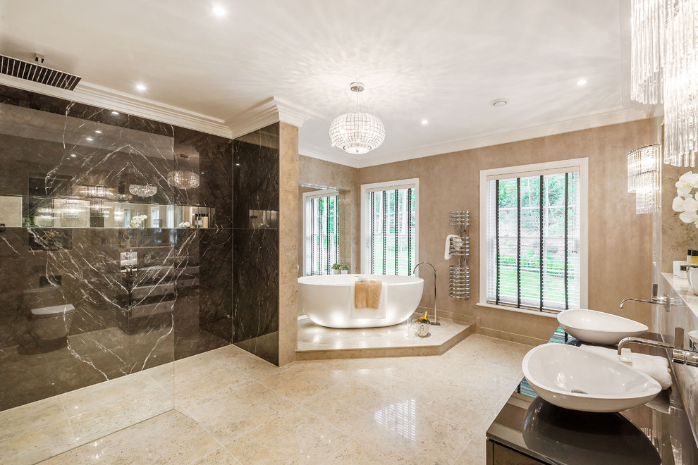 This is an example of a contemporary master bathroom in Surrey with a freestanding tub, a curbless shower, beige walls, a vessel sink and an open shower.