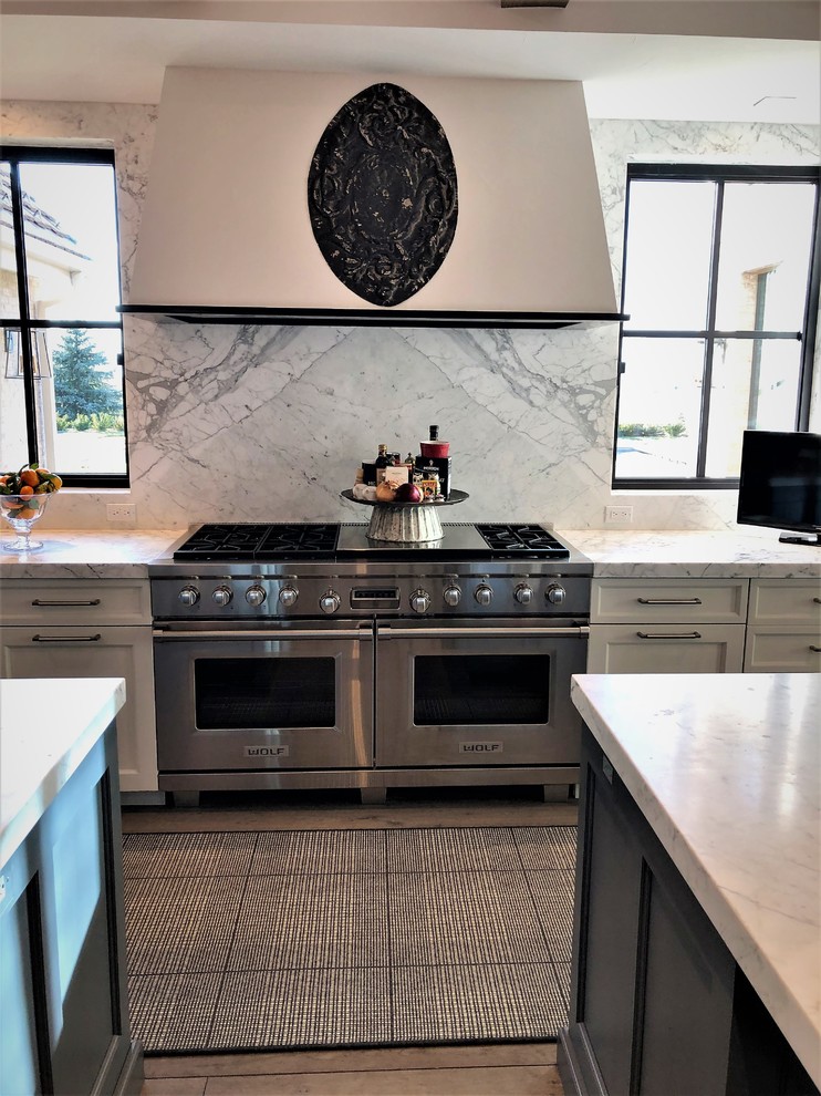 Example of a transitional kitchen design in Denver