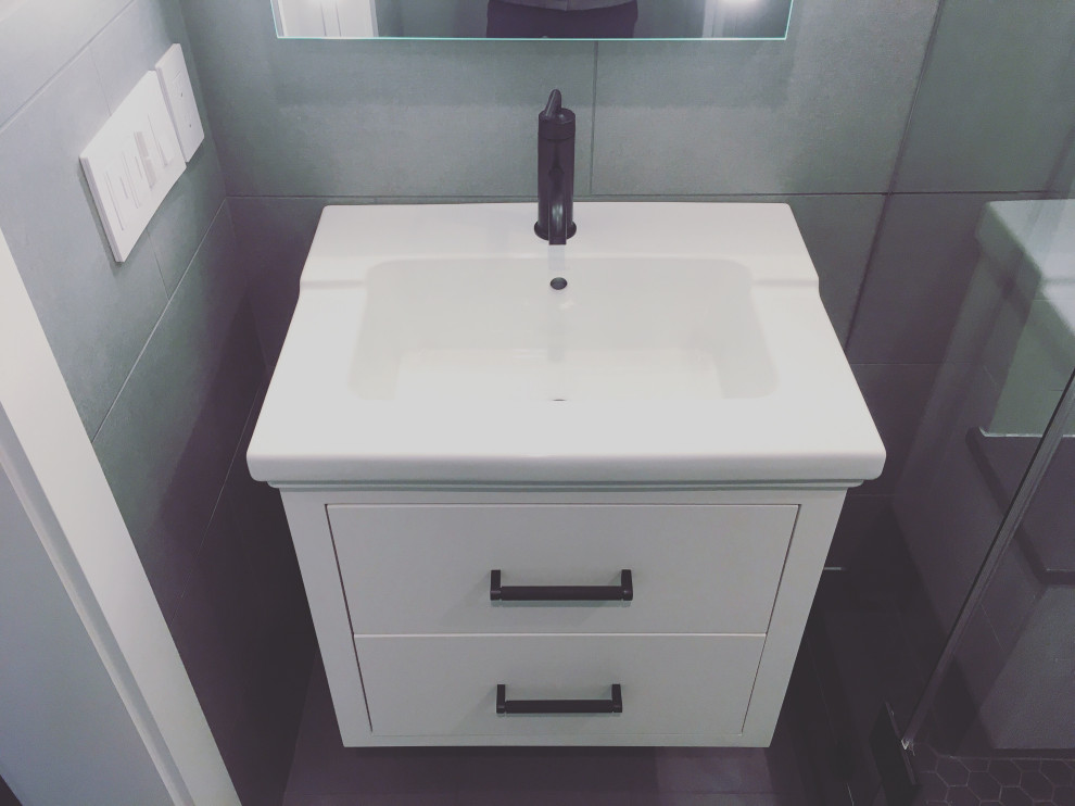 Design ideas for a small modern cloakroom in Burlington with flat-panel cabinets, white cabinets, a one-piece toilet, grey tiles, ceramic tiles, grey walls, ceramic flooring, an integrated sink, engineered stone worktops, grey floors, white worktops, a floating vanity unit, all types of ceiling and all types of wall treatment.