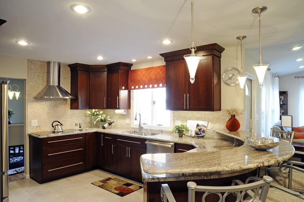 Eat-in kitchen - large transitional u-shaped ceramic tile and beige floor eat-in kitchen idea with a double-bowl sink, shaker cabinets, dark wood cabinets, granite countertops, beige backsplash, mosaic tile backsplash, stainless steel appliances and a peninsula