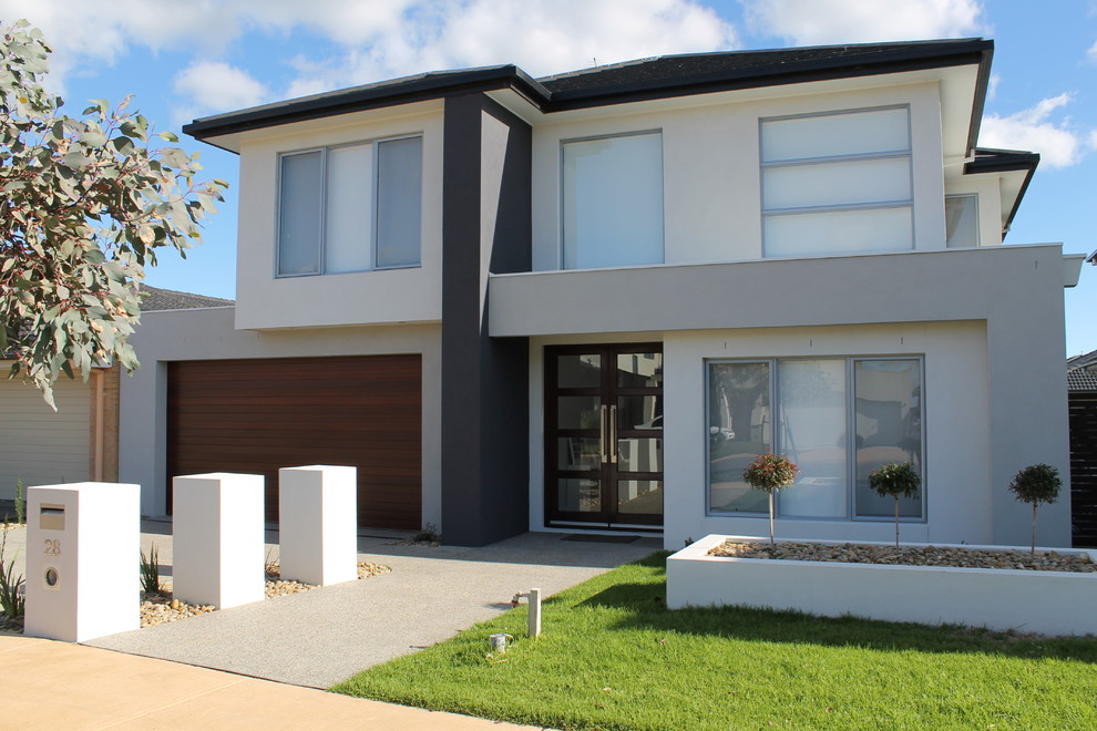 Photo of a contemporary two-storey white exterior in Melbourne.