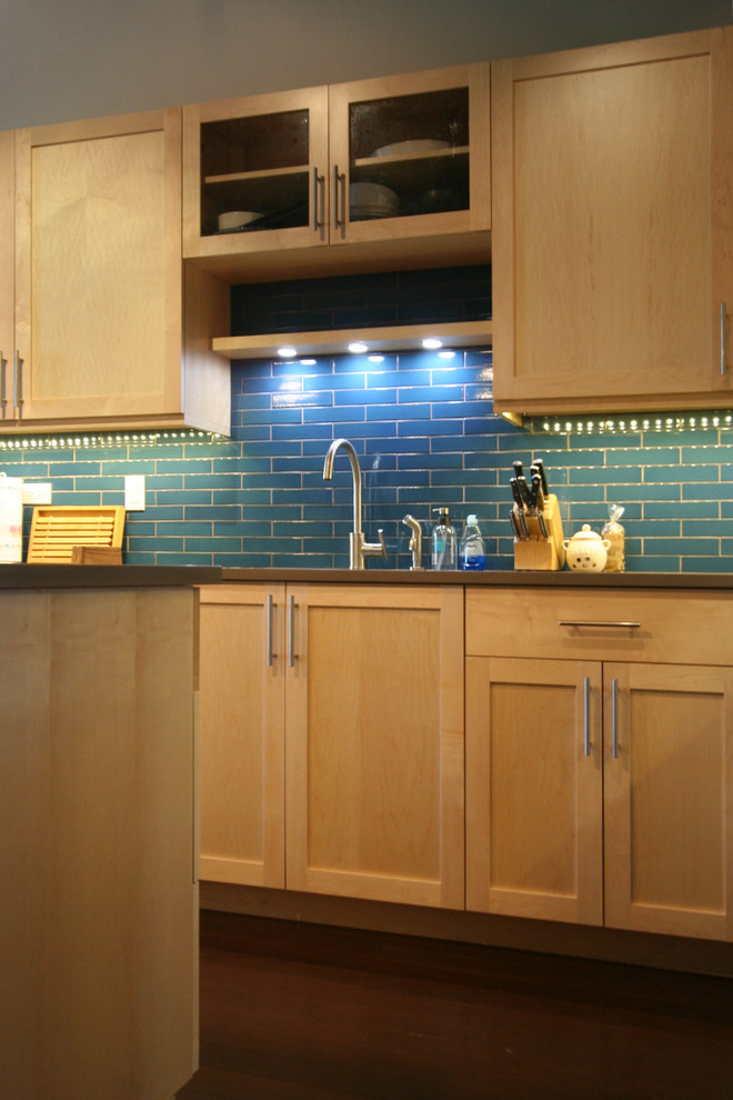 Large mountain style l-shaped dark wood floor eat-in kitchen photo in Chicago with an undermount sink, shaker cabinets, light wood cabinets, quartz countertops, blue backsplash, ceramic backsplash, stainless steel appliances and an island