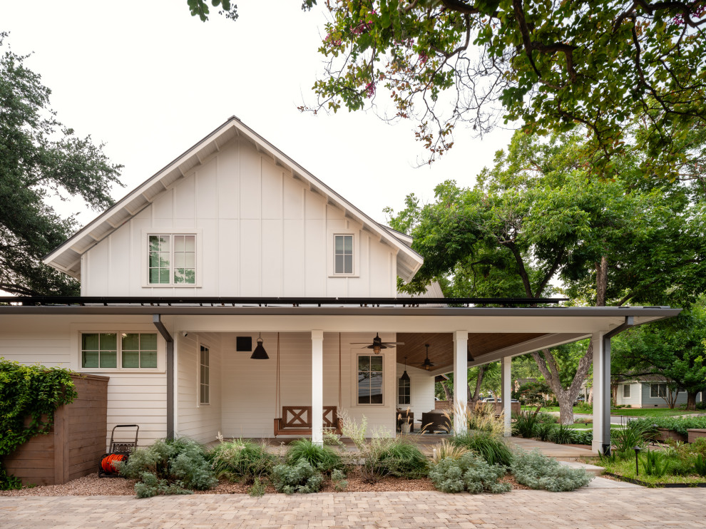 Farmhouse white gable roof photo in Austin