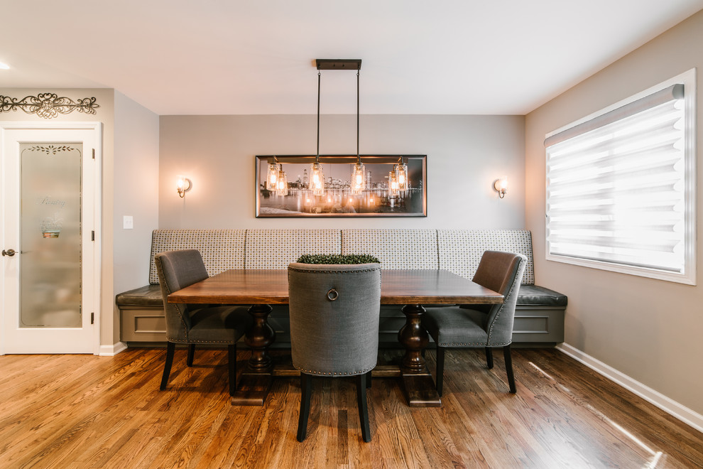 Mid-sized transitional open plan dining in Chicago with grey walls, medium hardwood floors, brown floor and no fireplace.